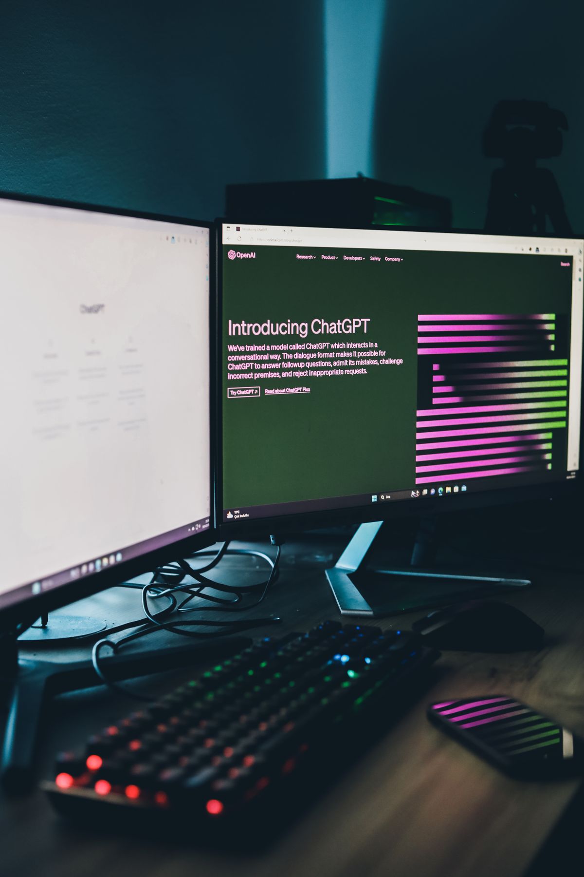 Dual monitors glowing with AI tools in a dark studio